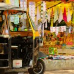 black auto rickshaw on road during daytime